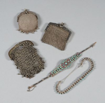 a lot of purses that are sitting on a table