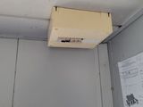 a air conditioner hanging from the ceiling in a room