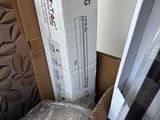 a stack of boxes sitting on the floor next to a bed