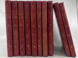 une pile de six livres rouges empilés les uns sur les autres