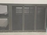 a close up of a metal panel with holes on it