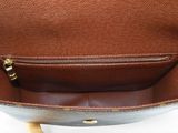 the inside of a brown purse with a zipper on it