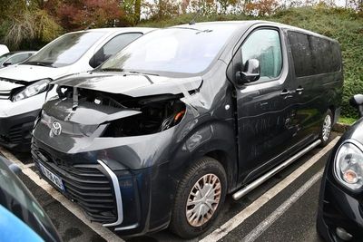 a black van that has been damaged in a parking lot