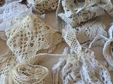 many different types of crocheted laces on a table