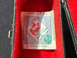 a piece of paper in a red case on a table