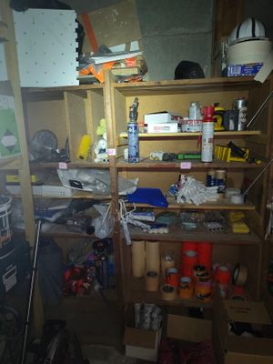 a room filled with lots of clutter and tools