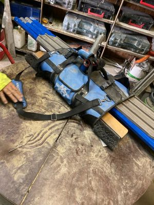 a person working on a piece of equipment in a workshop