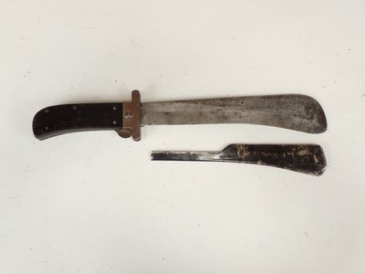 two knives that are sitting on a white surface