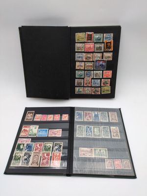 a black folder with stamps on it sitting on top of a table