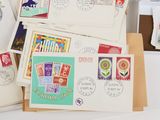 a lot of different stamps on the envelopes