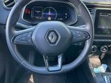 a picture of the interior of a car with a steering wheel and dashboard