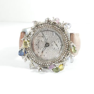 an image of a woman ' s wrist watch with multi colored stones