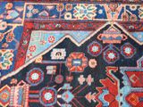 an image of a close up of a rug on a wooden floor