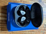 a close up of a pair of earphones in a box on a table