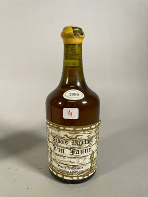 bottles of liquor are lined up in a row on a table