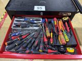 many different tools in a tool box on the floor