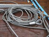 a rope that is laying on the ground next to a pair of scissors