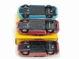 three toy cars that are sitting on top of each other