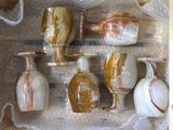 many different types of vases sitting in a box