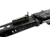 a machine gun that is sitting on top of a table