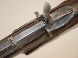a close up of a gun that is on a table