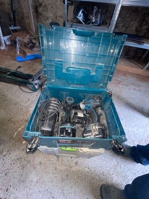 a blue tool box with a bunch of tools inside of it