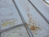 a metal roof that has a lot of rust on it