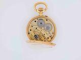 an image of a gold pocket watch on a white surface