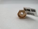 a close up of a metal nut on a white surface