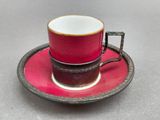 a cup and saucer on a saucer on a table