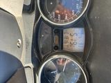 a close up of a speedometer and gauges on a motorcycle