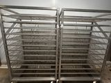 two large metal racks in a room with a white wall