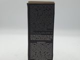 a black box with a label on it sitting on a white surface