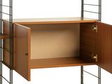 a shelf with a door open and a shelf with a shelf underneath it