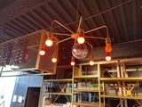 a light that is hanging from the ceiling in a restaurant