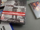 a video game on a table next to some other games