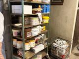 a man standing in front of a shelf of food