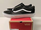 vans old skooler slip on sneakers in black and white