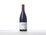 a bottle of red wine sitting on top of a table