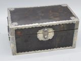 a black and silver box on a white surface