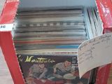 a red box with a lot of records in it
