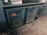 a microwave oven sitting on top of a metal cabinet