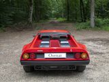 a red sports car parked in the middle of a dirt road