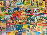 a lot of mickey mouse books on the floor
