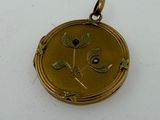an image of a gold locke with a blue stone in the center