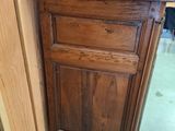 a wooden cabinet with a drawer on top of it