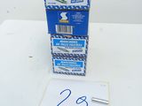 three boxes of toothbrushes sitting on top of a white table