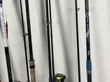 several fishing rods are lined up against a wall in a room
