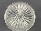 an image of a clear glass plate with a flower design on it