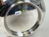 a silver vase that has a label on it